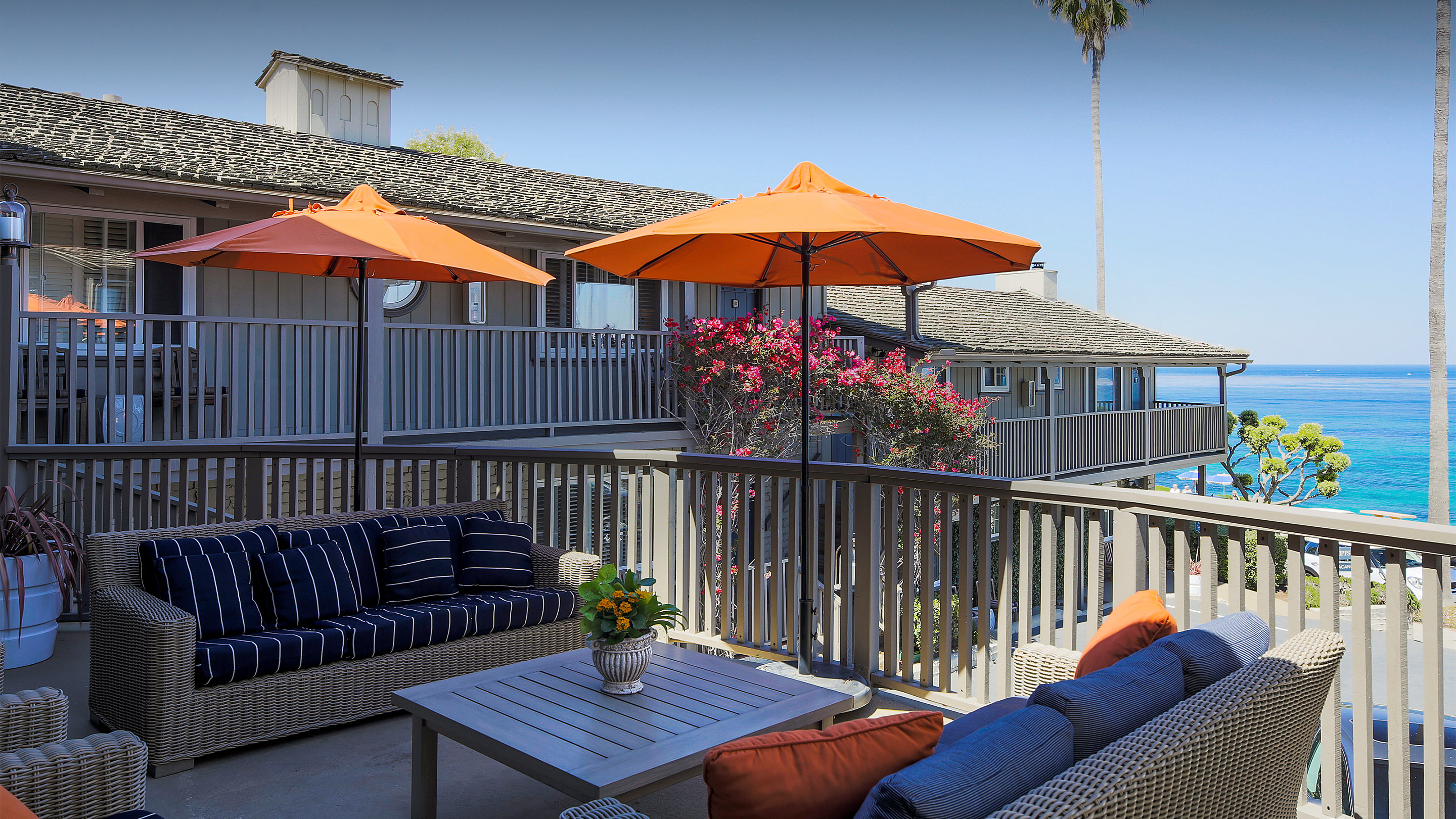 a deck with umbrellas and chairs