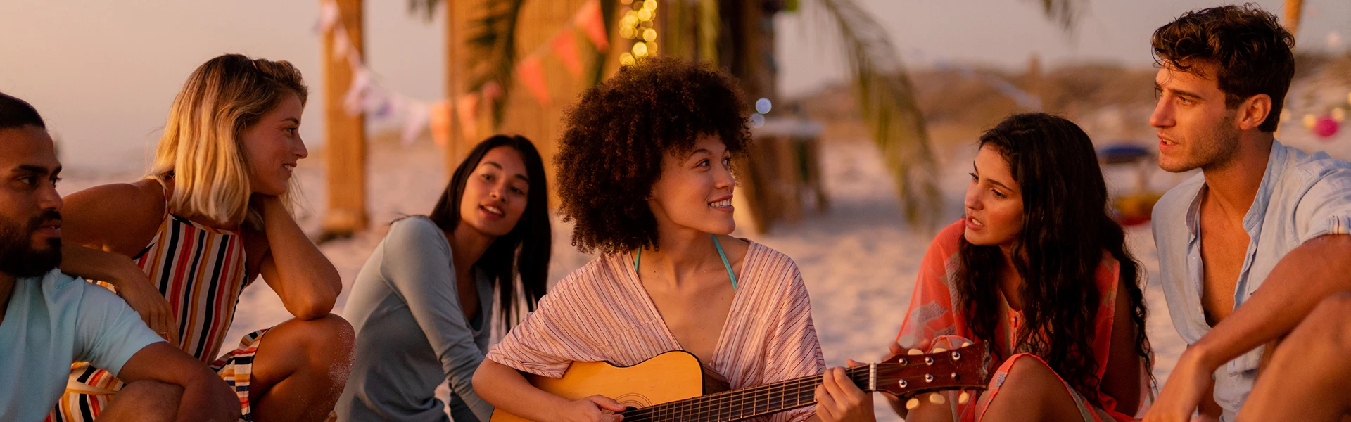 a group of people sitting and playing instruments
