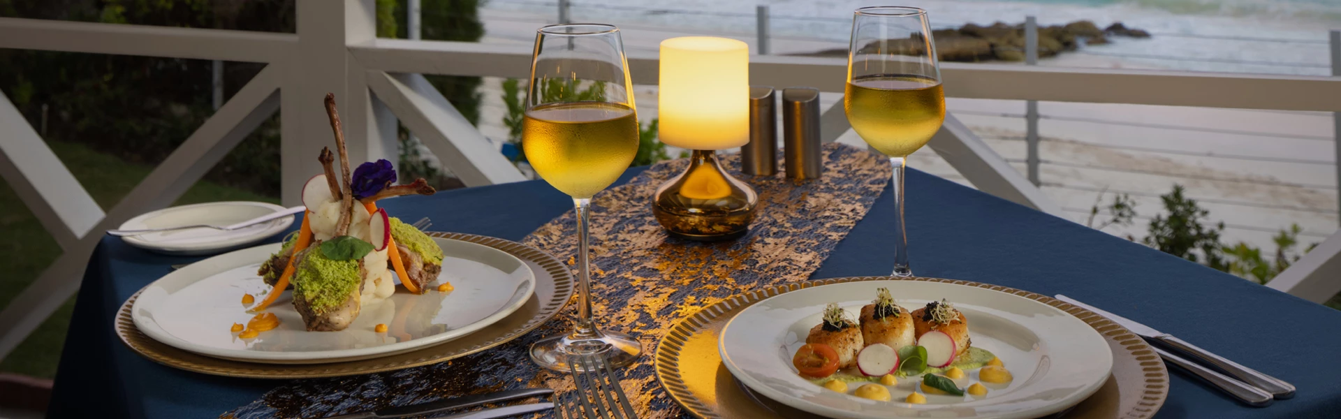 a table with plates and glasses of wine