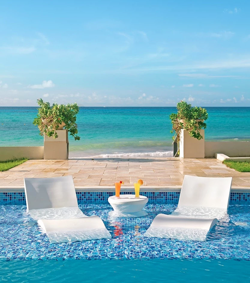 View of two chairs at a fancy pool