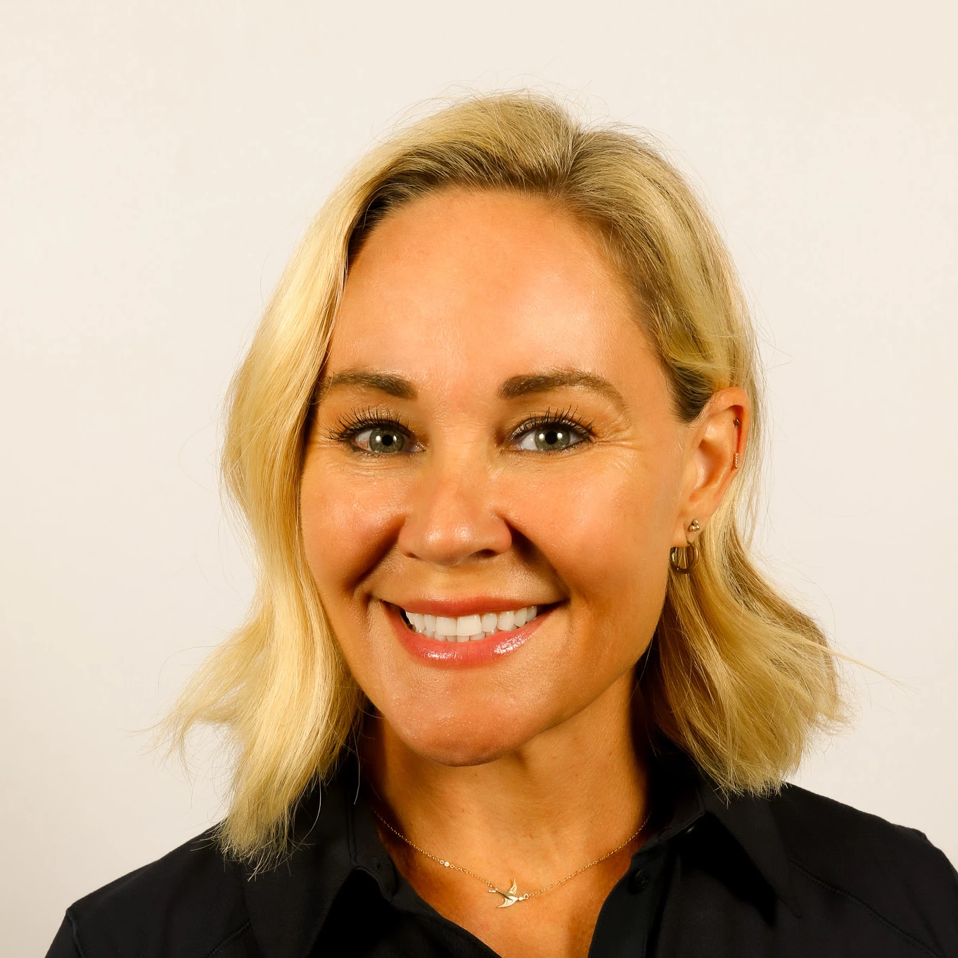 a woman smiling at camera