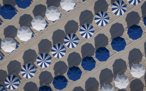 a group of umbrellas on a beach