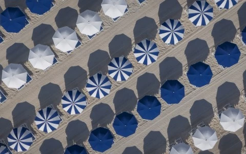 a group of umbrellas on a beach