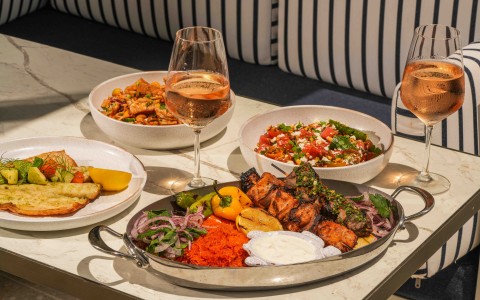 a table with plates of food and wine