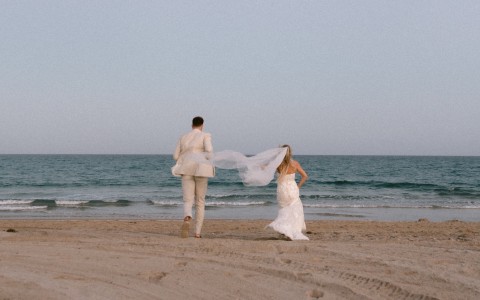 a man and woman on a beach