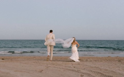 a man and woman on a beach