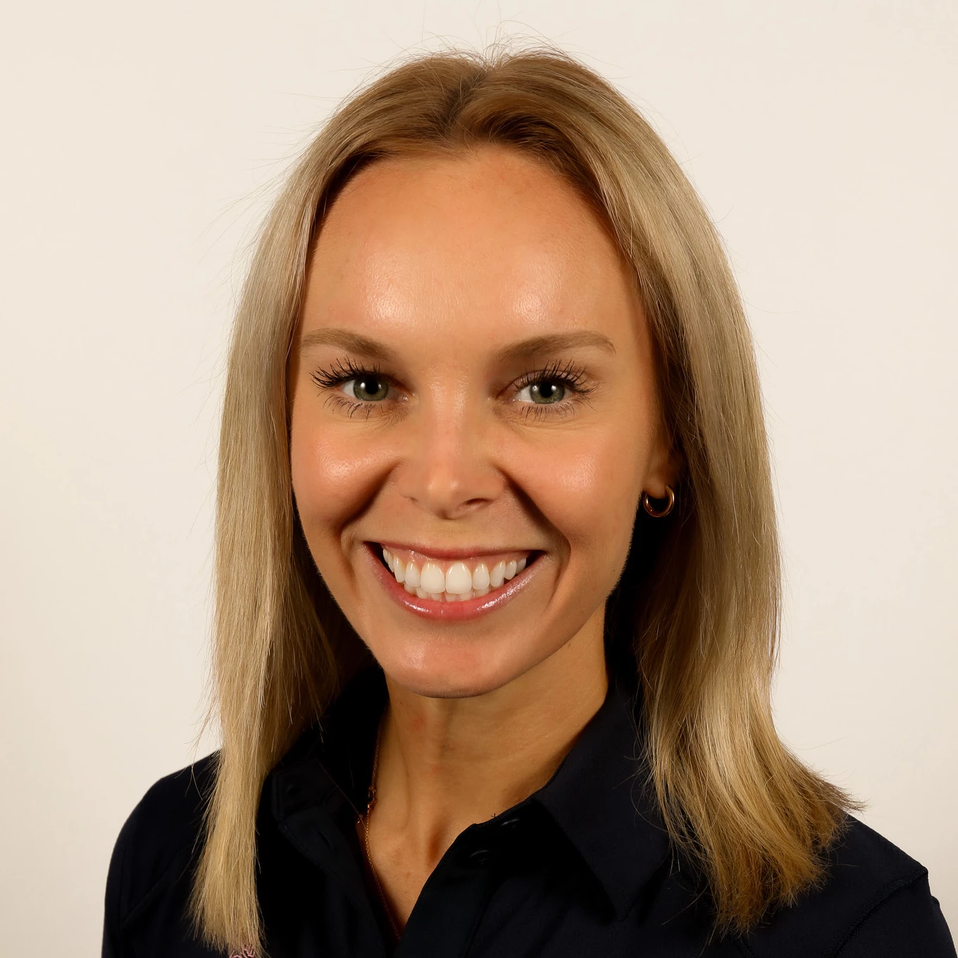 a woman smiling at the camera