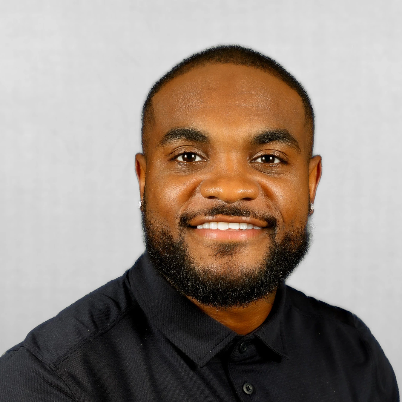 a man smiling for a picture