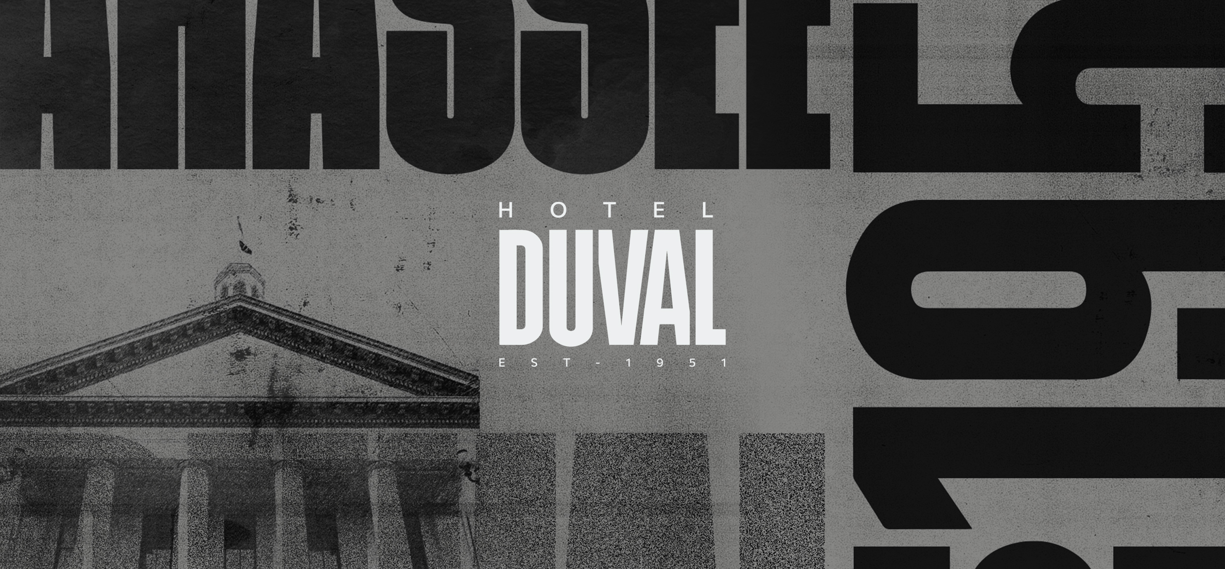 a sign with the hotel duval logo