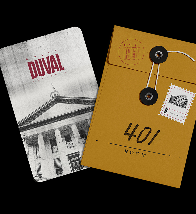 a yellow envelope with black buttons and a keycard with a picture of a building on it