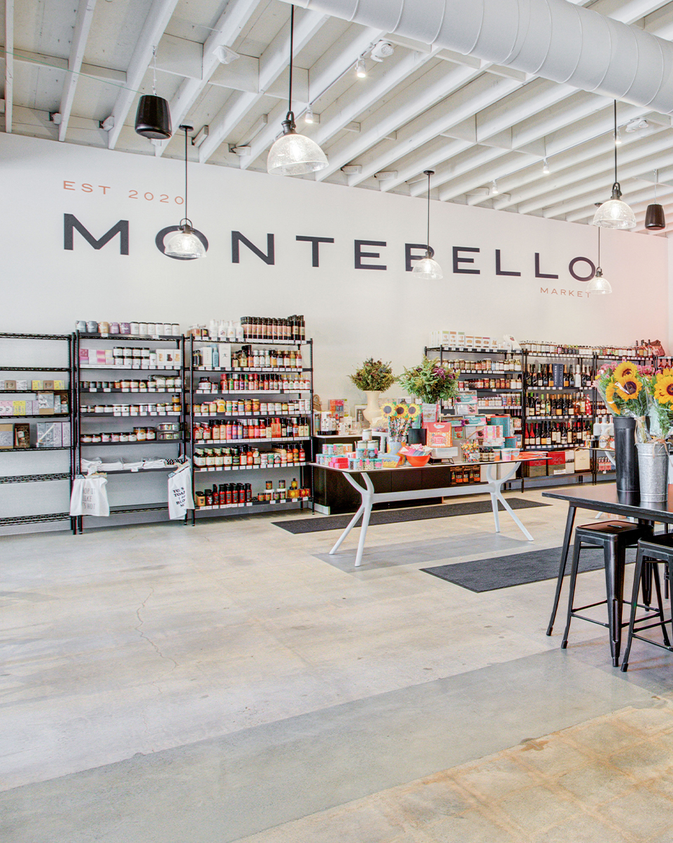 a store with shelves of food and drinks with Montebello on the wall