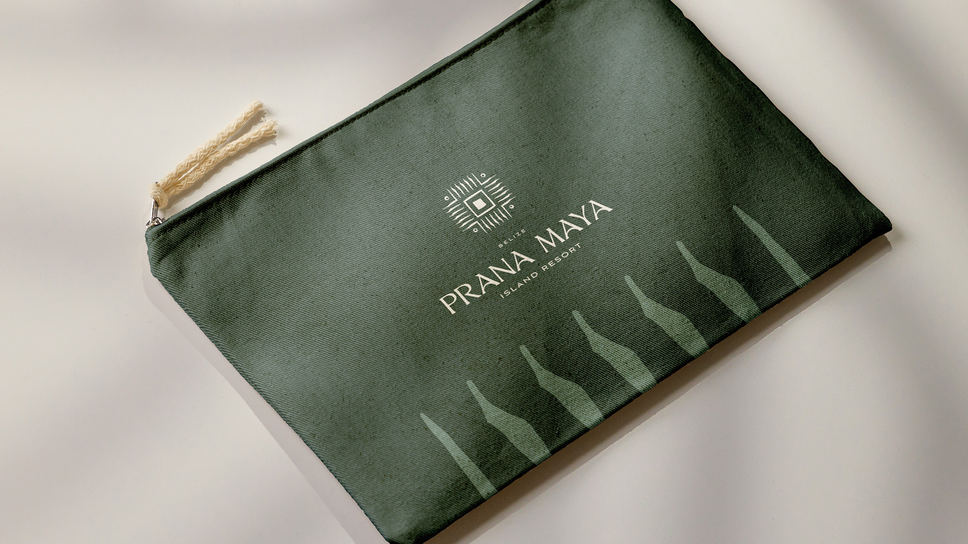 a green bag with white text and a logo on it