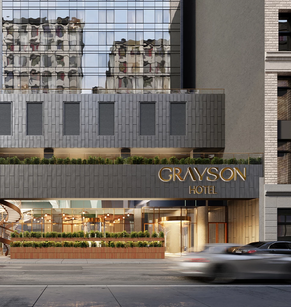 a car driving past a hotel