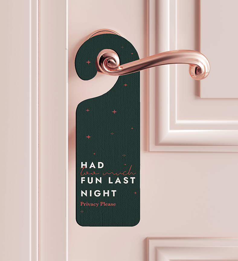 a door handle with a privacy sign in The Hotel Maloney branding