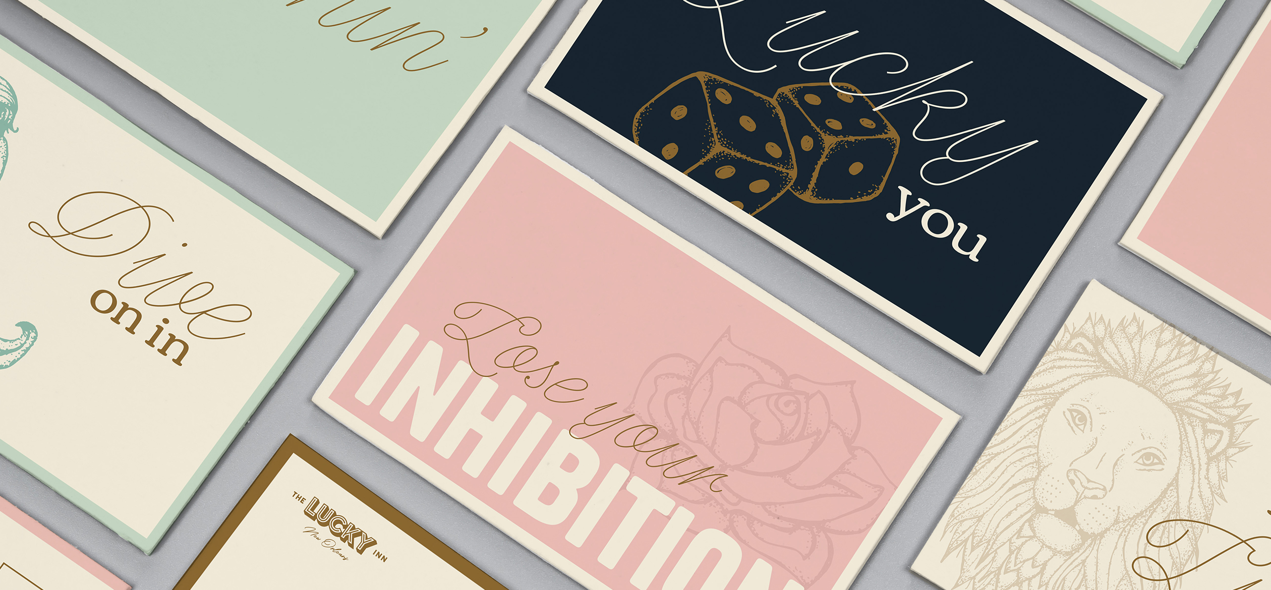 a group of post cards with Lucky Inn branding