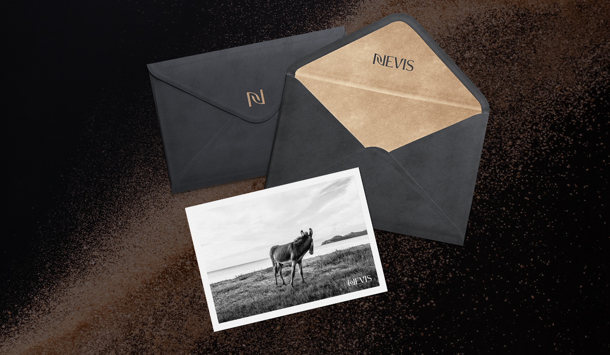 a black envelopes with a picture of a horse and nevis logo