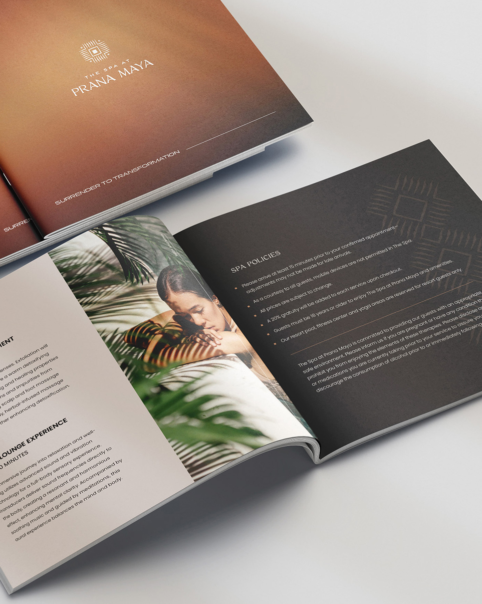 an open a book with text on it and prana maya logo