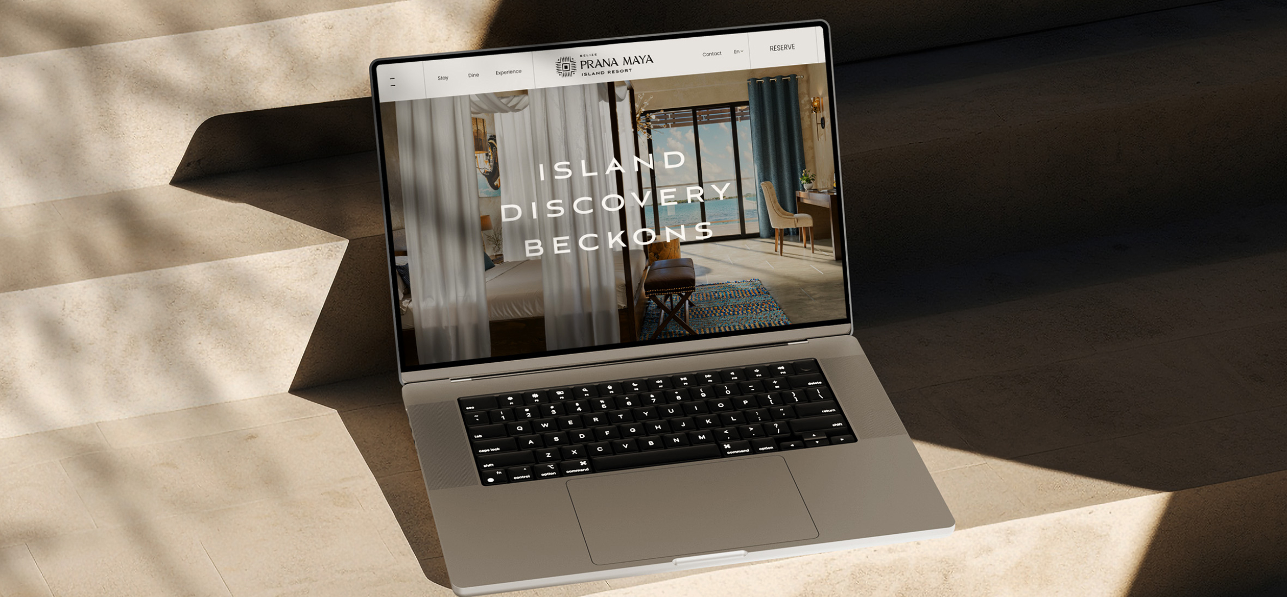 a laptop with a Prana Maya room image