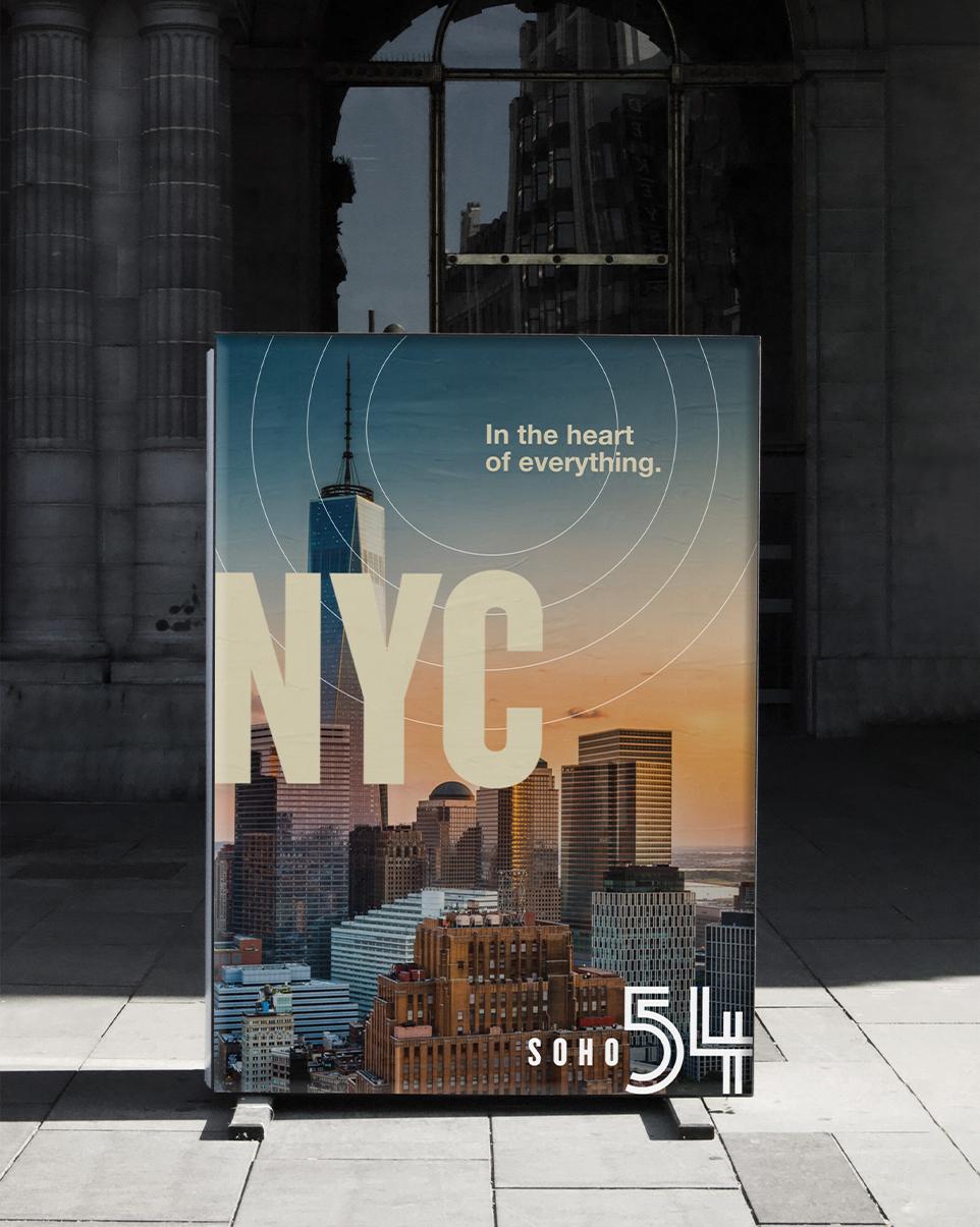 a sign on the ground that has NYC on it and overlaid text that says Soho 54