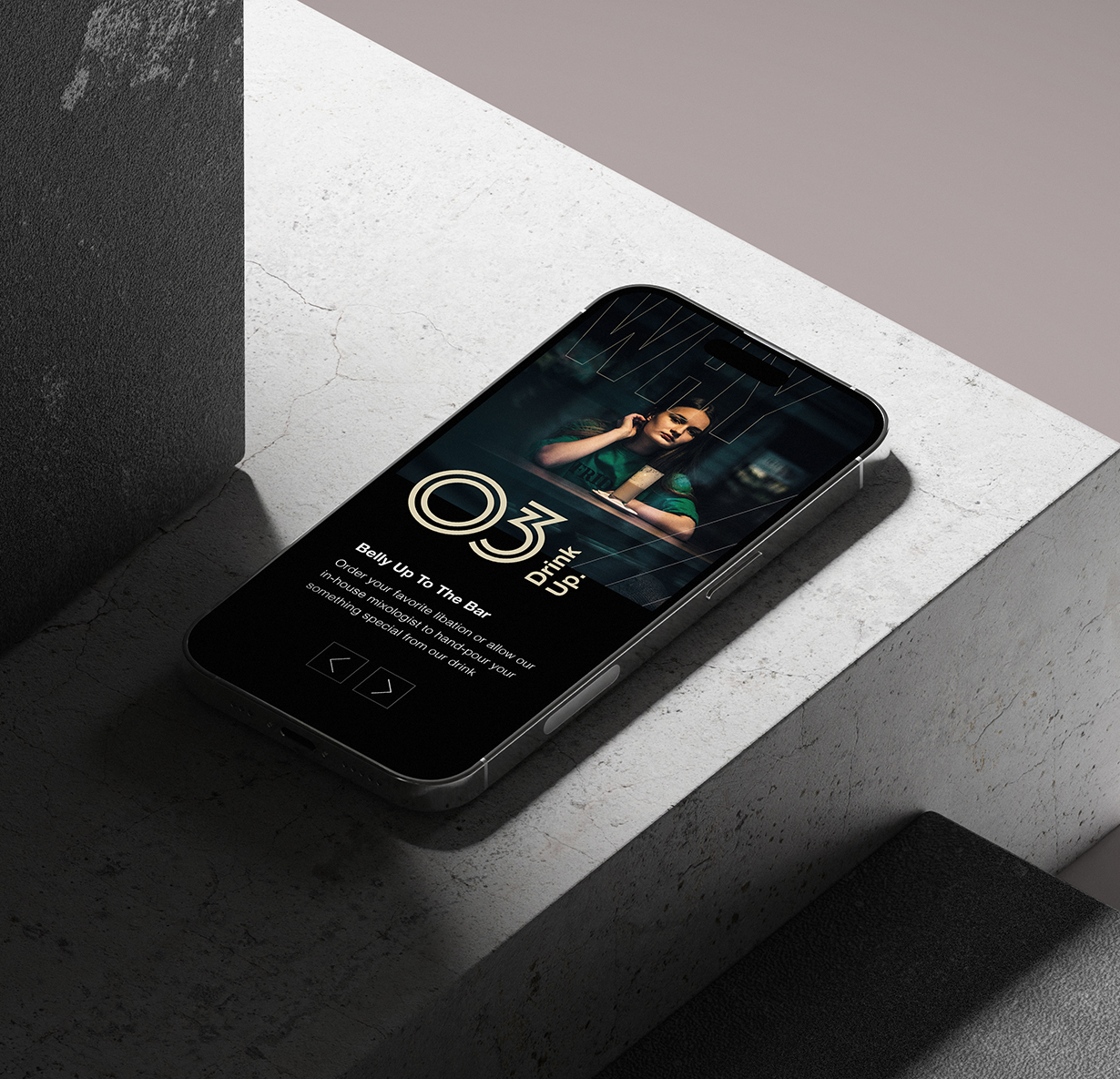 a cell phone on a ledge that has the Soho 54 website on it