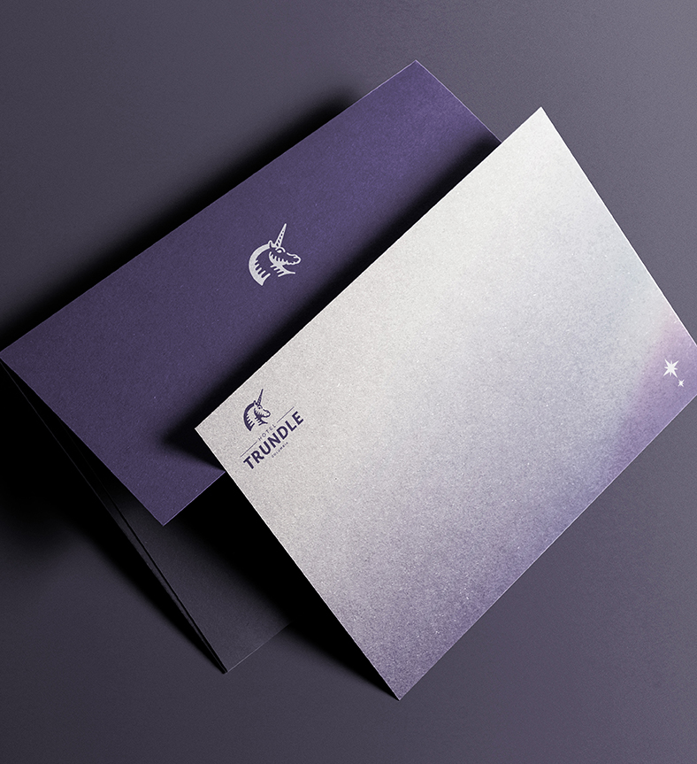 an envelope and paper with the Trundle logo on it