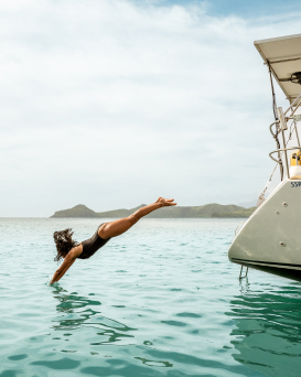 a woman diving into the water