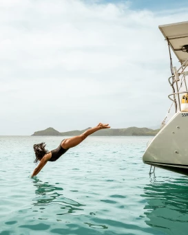 a woman diving into the water