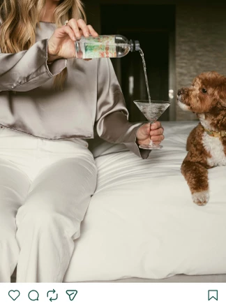 a woman pouring liquid into a glass of liquid