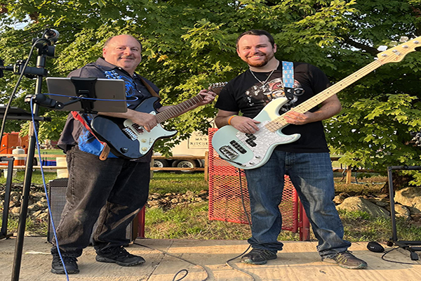 Band, Achilles Heart holding guitars posing for a picture