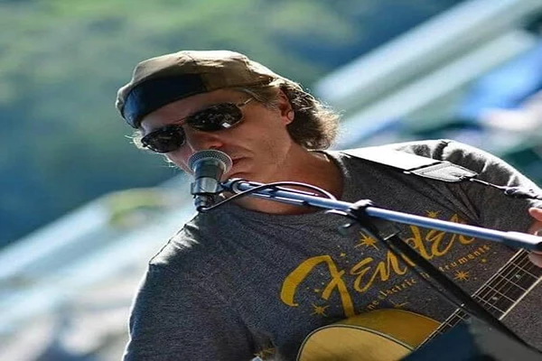 Bobby Ventura playing a guitar