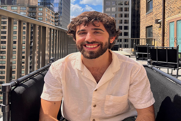 a man sitting on a balcony