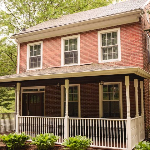 a brick house with a porch