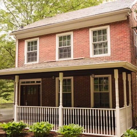 a brick house with a porch