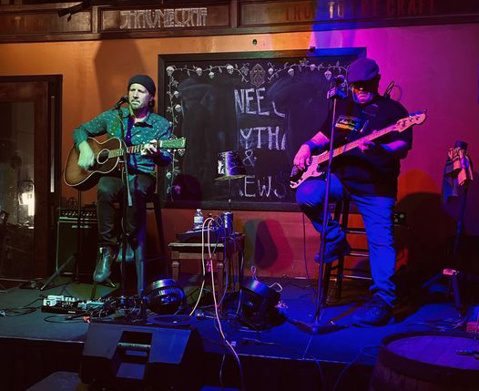 Performers, the Pocono Duo playing instruments on a stage