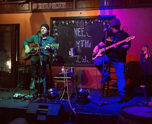 Performers, the Pocono Duo playing instruments on a stage