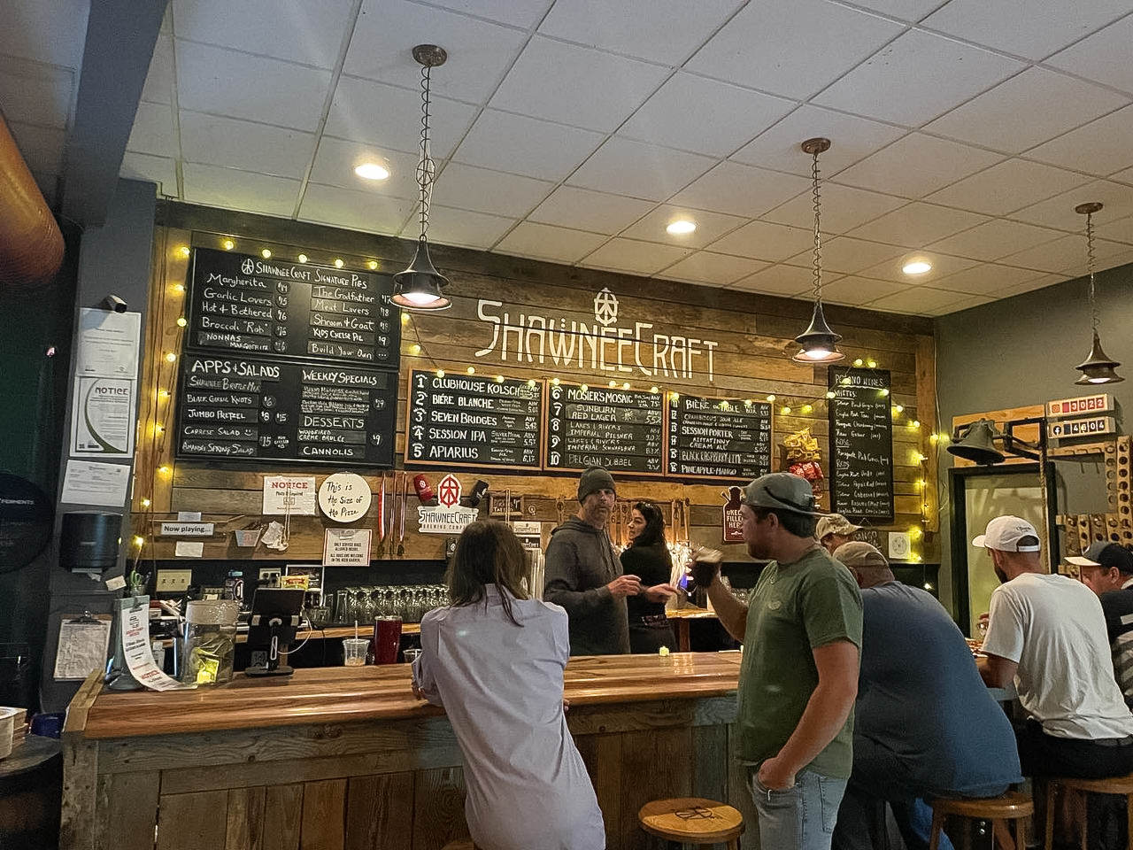 people standing in a bar
