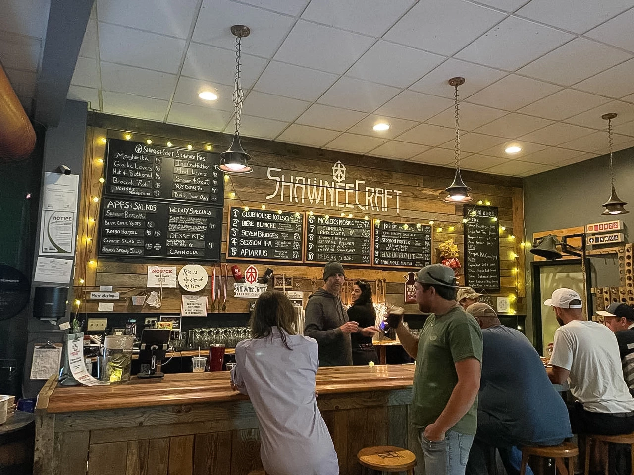 people standing in a bar