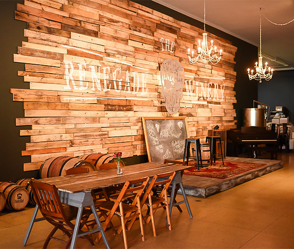a room with a table and chairs and a piano