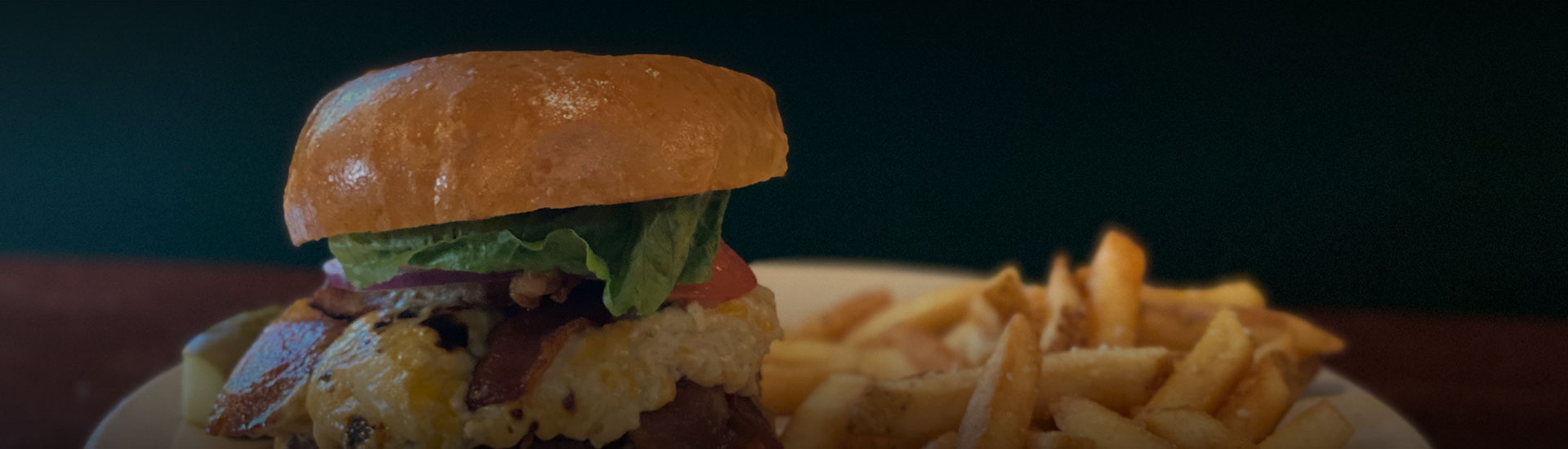 a close up of a burger and fries