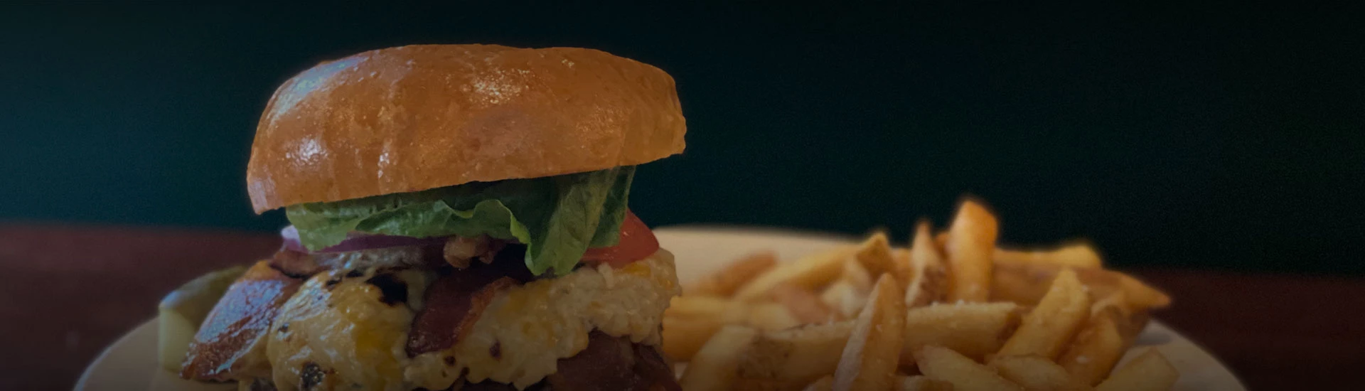 a close up of a burger and fries