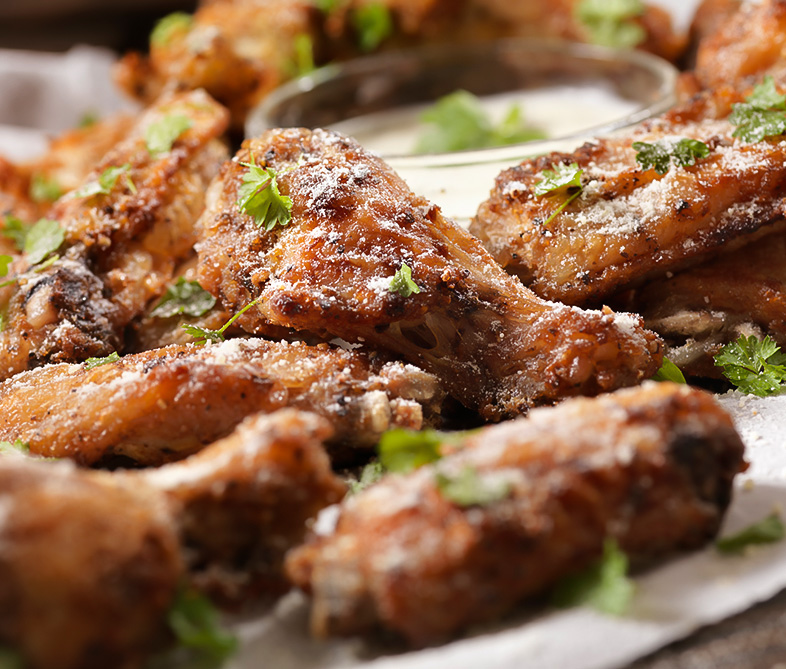 a plate of fried chicken wings
