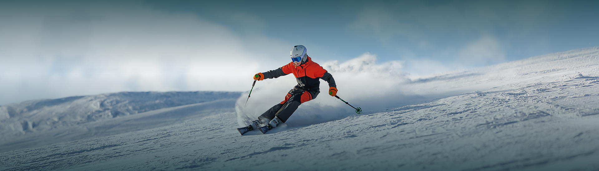 a person skiing down a snowy hill