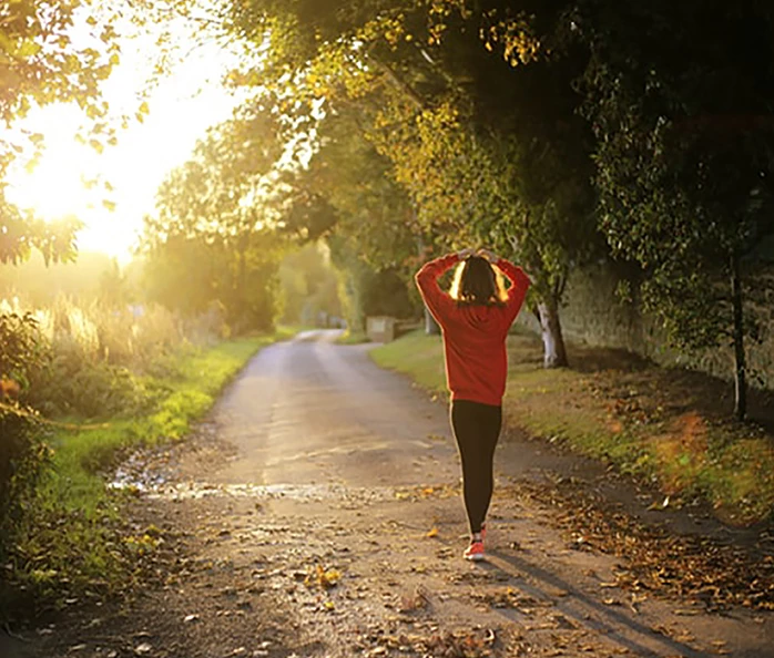 a woman walking on a road