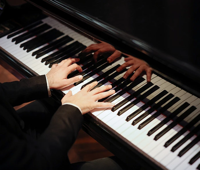 a person playing a piano