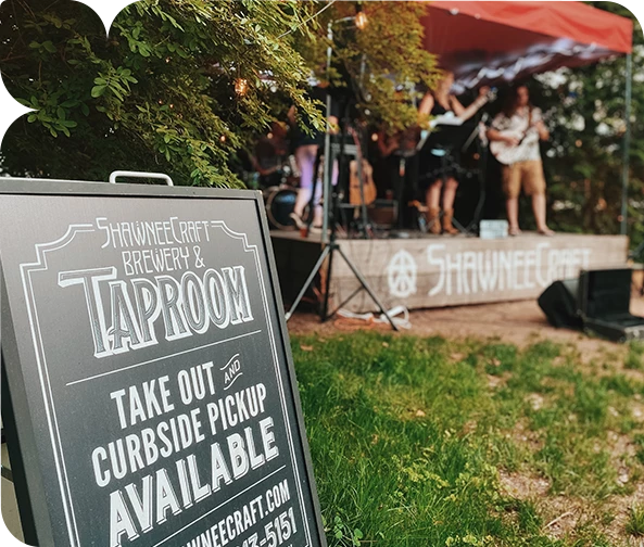 a sign with a band in the background
