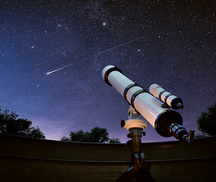a telescope in front of stars