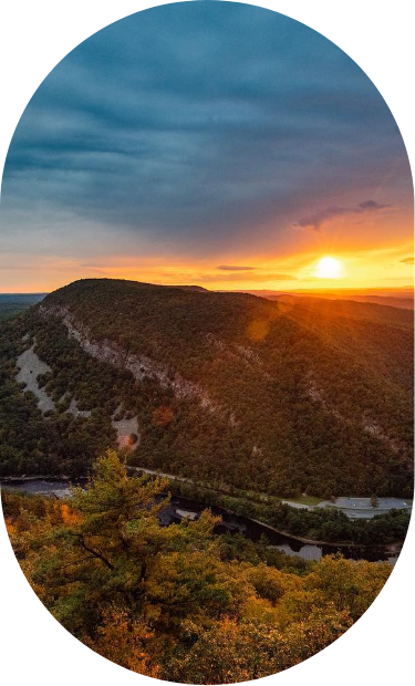 a sunset over a mountain