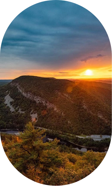 a sunset over a mountain