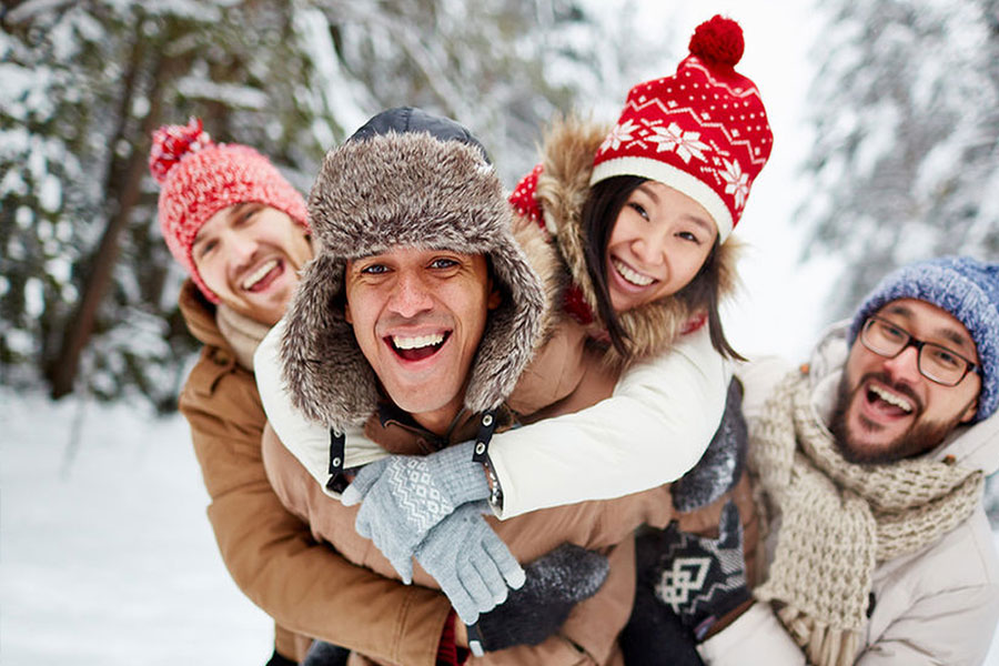 a group of people in winter clothes