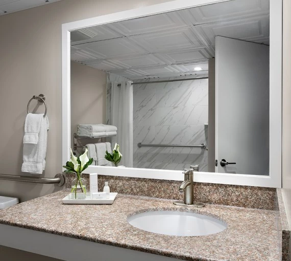 a bathroom with a mirror and sink